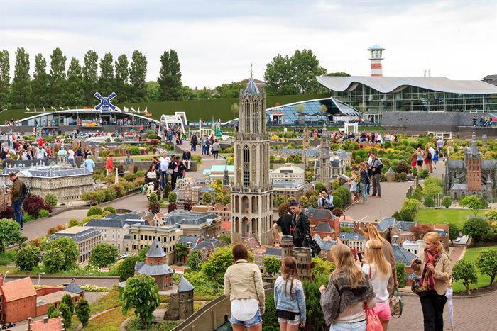 Families exploring the miniature city park at Madurodam in the Netherlands